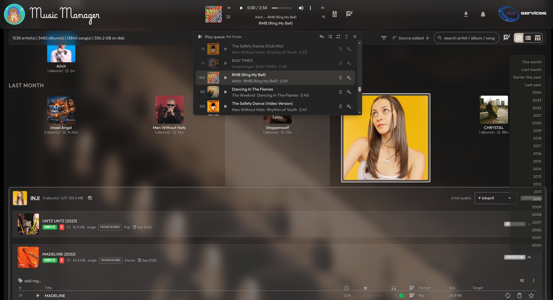 MusicManager: dark library dashboard with artist tiles, play queue and lossless badges